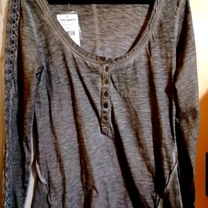 NWT Free people Grey top with lace sleeves. Size L